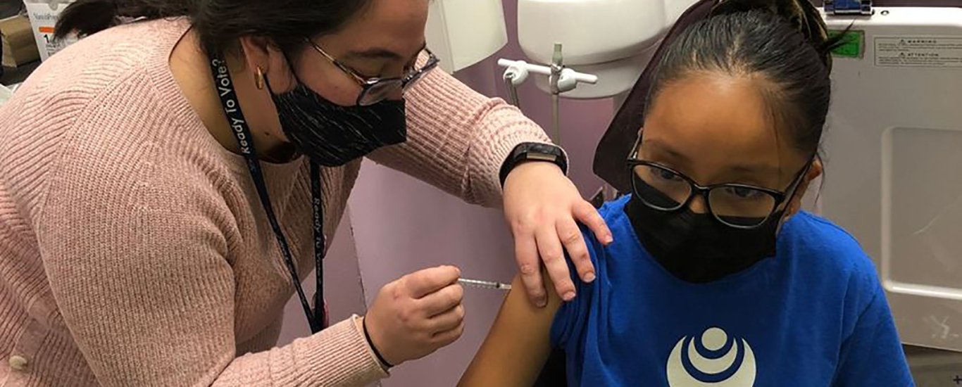 Children's Aid student getting vaccinated