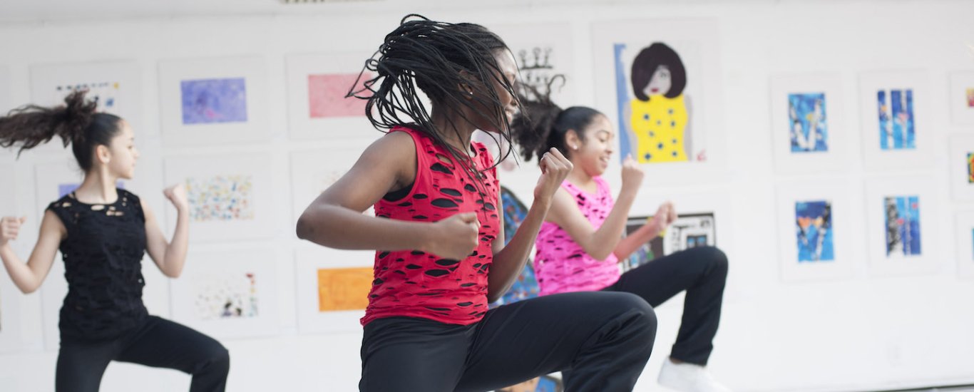 Students dancing in a performance