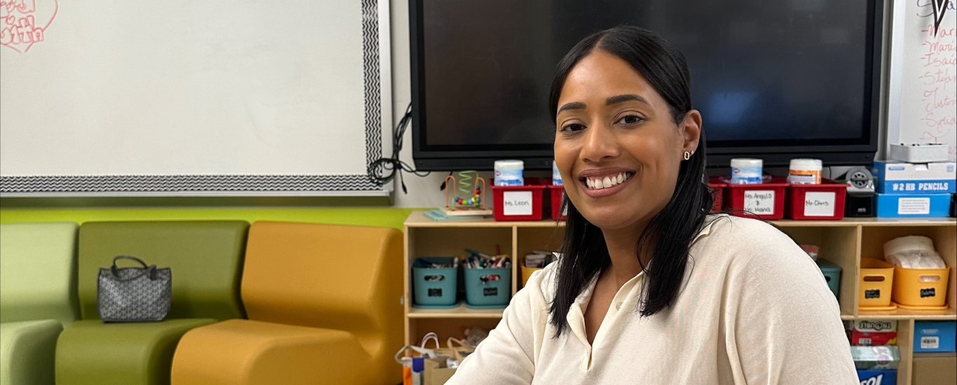 Ivette Medina sitting at a table
