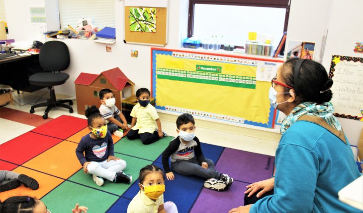 Kids and teacher at our Bronx Early Childhood Center