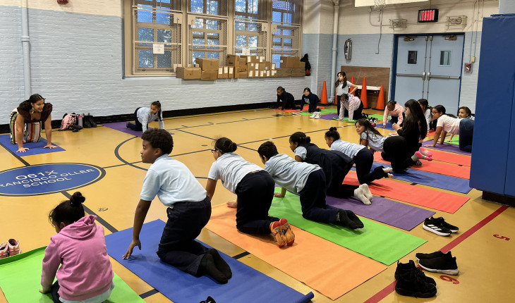 Students doing yogo