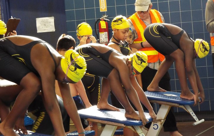 Stingrays swim team on starting blocks