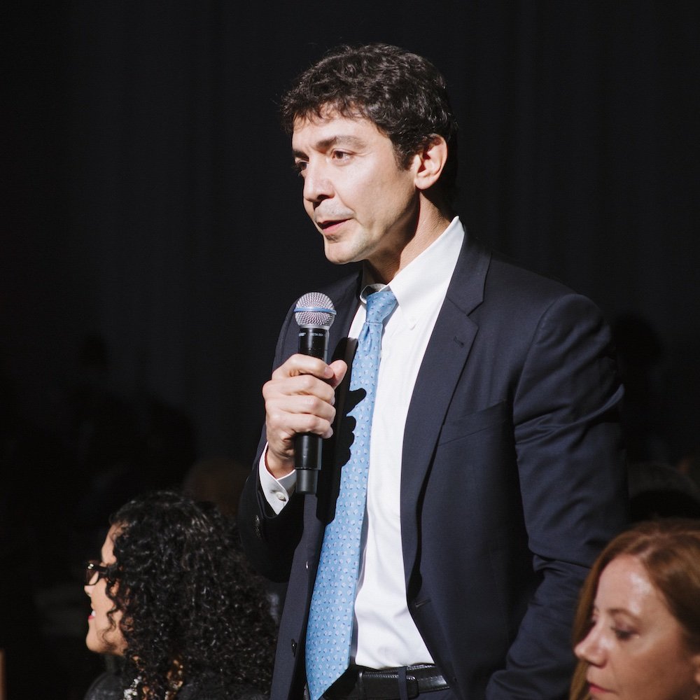 Dr. Raja Flores speaking