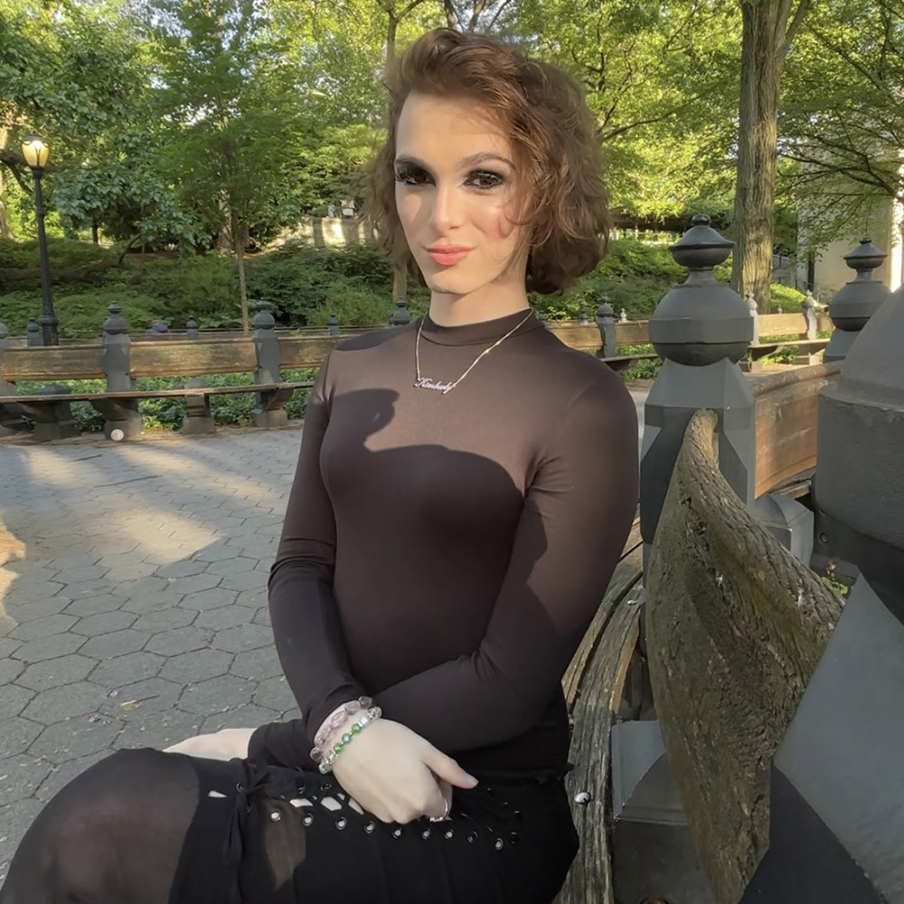 Kimberly Mercedes sitting in park