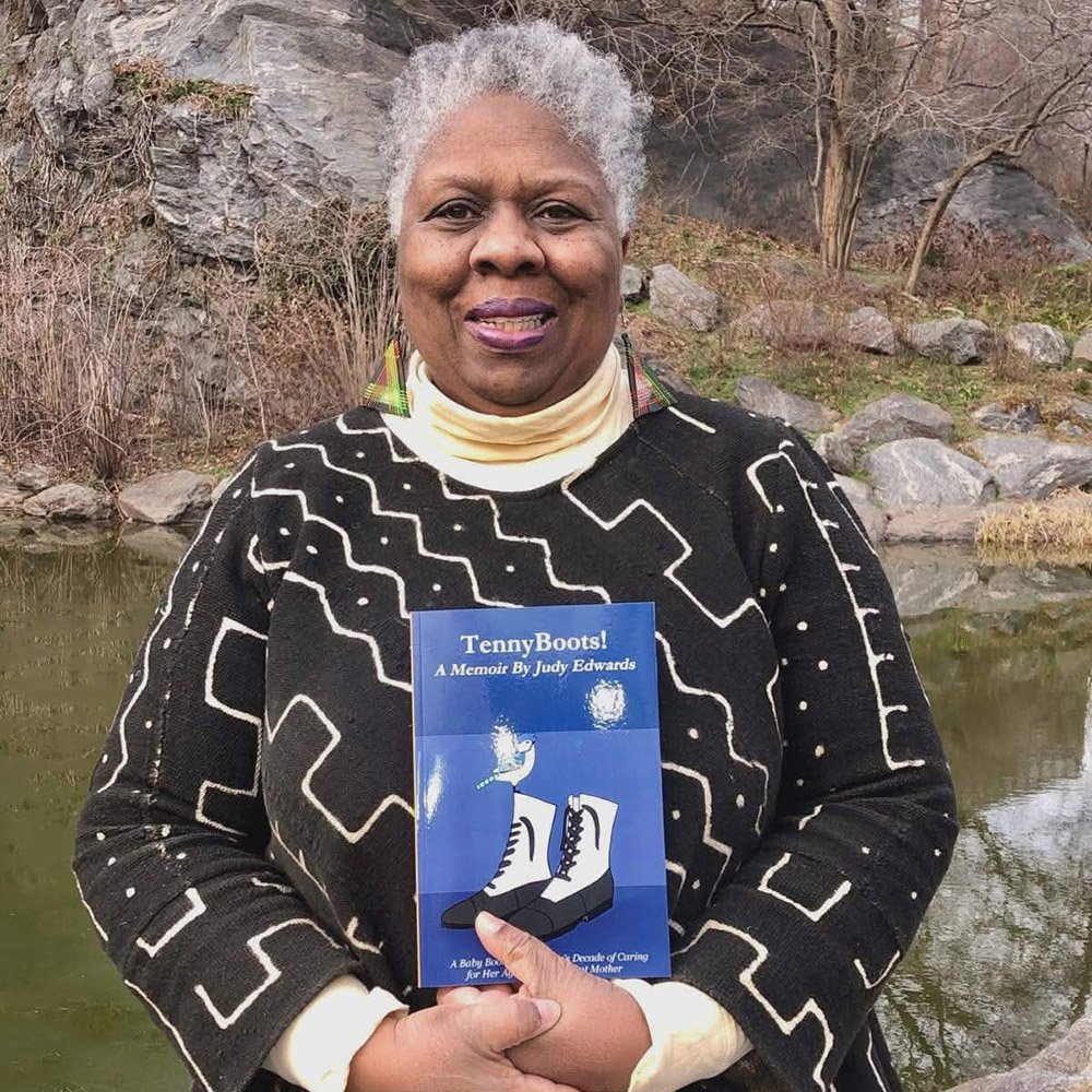 Judy Edwards holding book