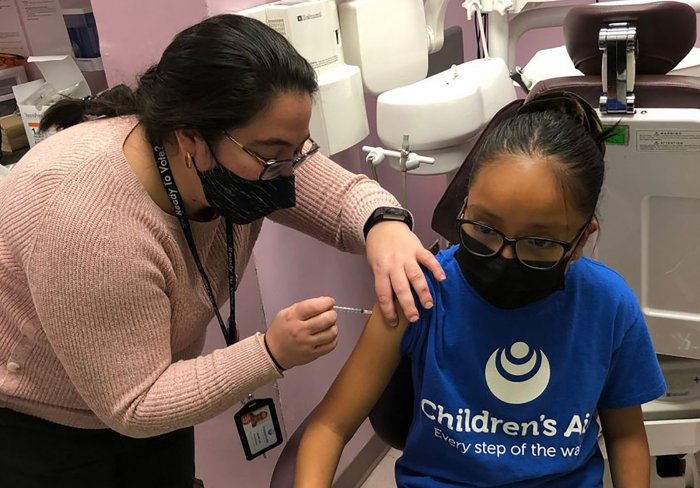 Children's Aid student getting vaccinated