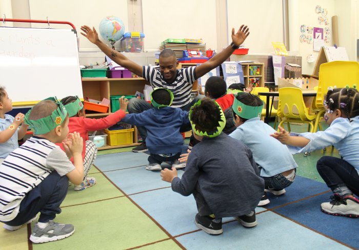 young kids crouching low to the floor