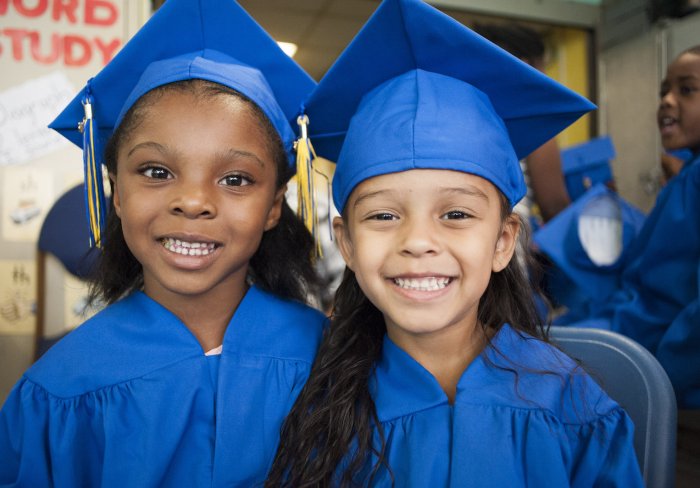 Two graduates from early childhood program