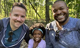 Jeff Bugajski and Tarik Flannagan with their daughter