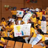 Students celebrating in auditorium