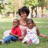 Family laying down on the ground