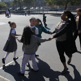 Teachers and students in a playground