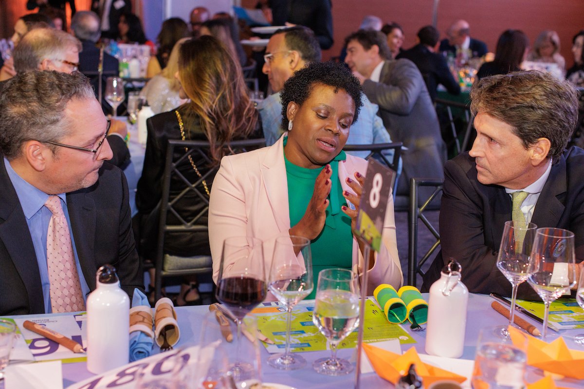 Guests listening intently to Executive Vice President Georgia Boothe.