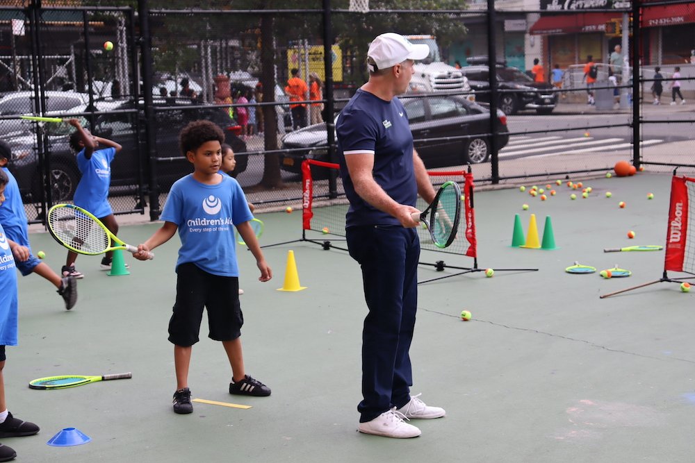 Patrick McEnroe teaching students