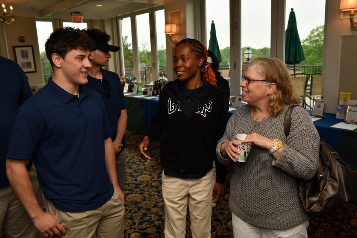 Suzanne Waltman with Curtis HS students